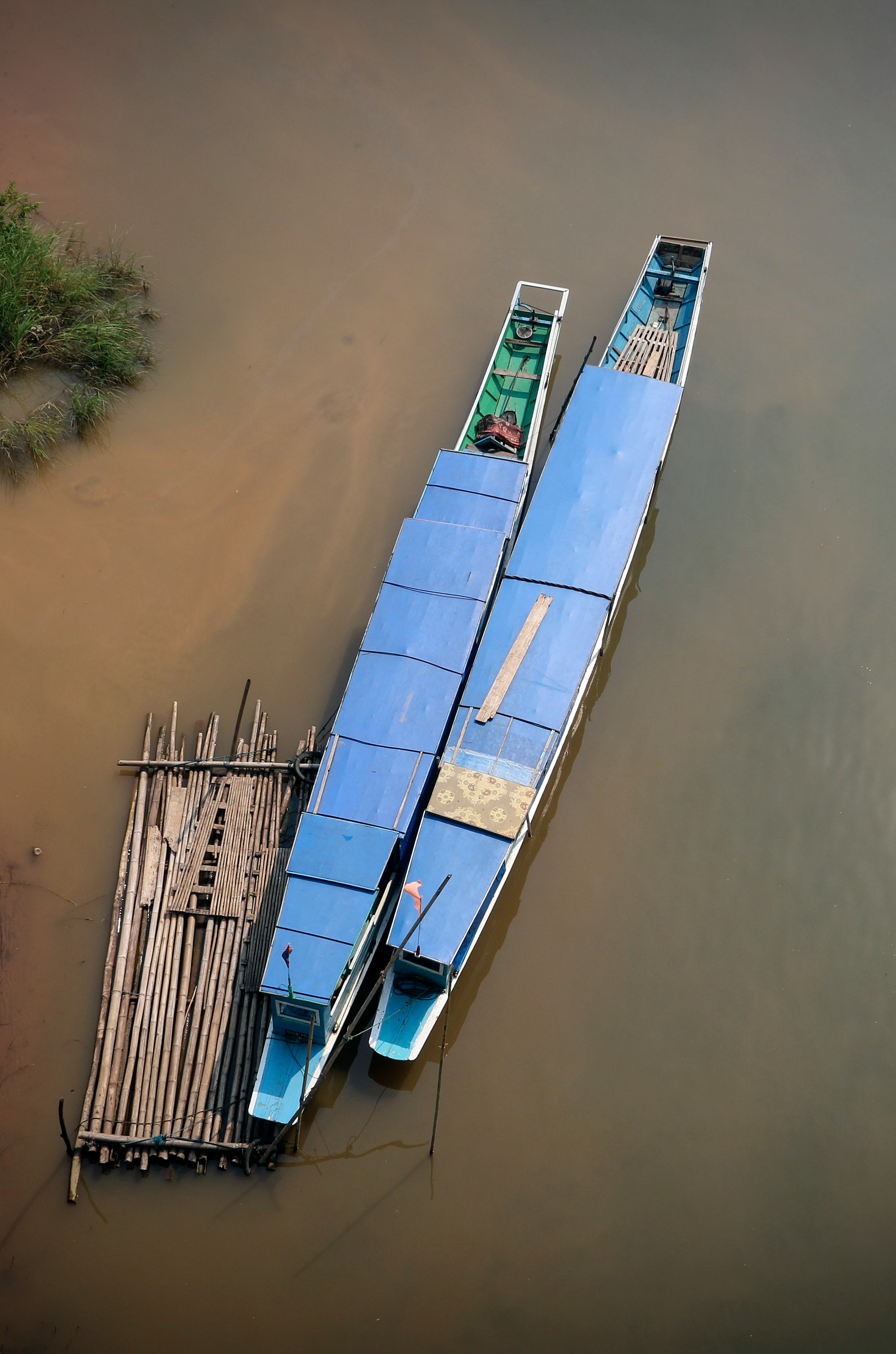 white and blue boat on water